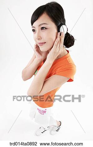 Stock Image - person, woman, Korean, room, pose, posture, concept. Fotosearch