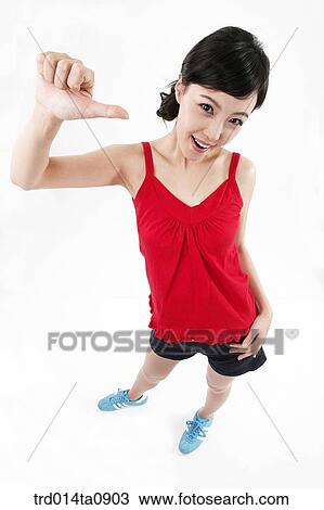 Stock Image - person, woman, Korean, room, pose, posture, concept. Fotosearch