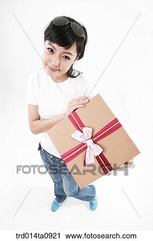 Stock Image - person, woman, Korean, room, pose, posture, concept. Fotosearch