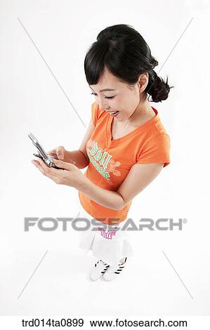 Stock Photo - person, woman, Korean, room, pose, posture, concept. Fotosearch