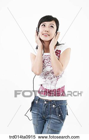 Stock Photography - person, woman, Korean, room, pose, posture, concept. Fotosearch