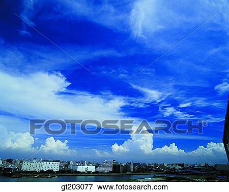 Stock Photo - cloud, clouds, city, town, sky, outdoor, exterior. Fotosearch