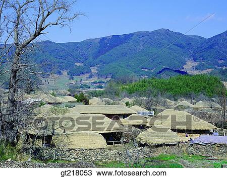 Stock Image - exterior, day, daytime, daylight, folk town, village, thatched house. Fotosearch