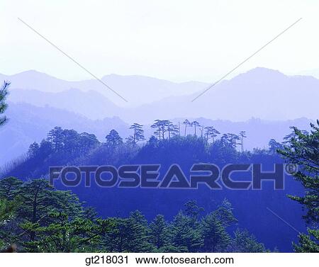 Stock Image - exterior, day, daytime, daylight, mountain, mist, fog. Fotosearch