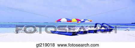 Stock Photo - beach, coast, beach umbrella, parasol, sea, chair, sandsy beach. Fotosearch