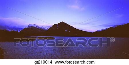 Picture - lake, mountain, sunset, sundown, ridgeline, sky, panorama. Fotosearch