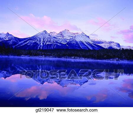 Stock Photo - mountain, lake, remaining snow, snowscape, snow, reflection, reflect. Fotosearch
