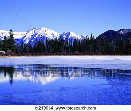mountain, lake, snowscape, snow, winter, reflection, reflect View Large Photo Image Picture - mountain, lake, snowscape, snow, winter, reflection, reflect. Fotosearch