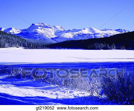 Stock Image - mountain, lake, snowscape, snow, winter, outdoor, exterior. Fotosearch