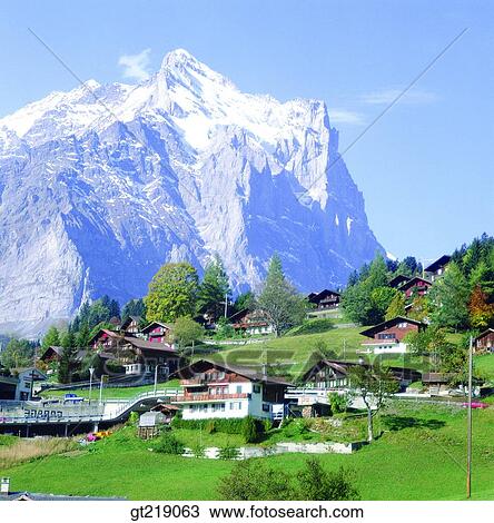 Stock Image - mountain, snowscape, snow, remaining snow, town, spring. Fotosearch