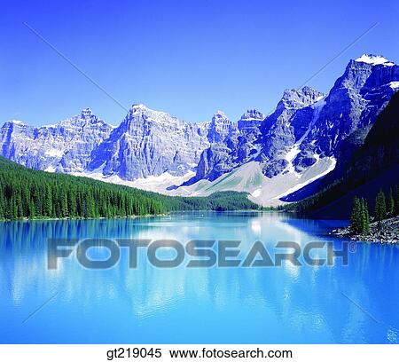 Stock Photography - river, Canada, remaining snow, mountain, forest, trees, summer. Fotosearch