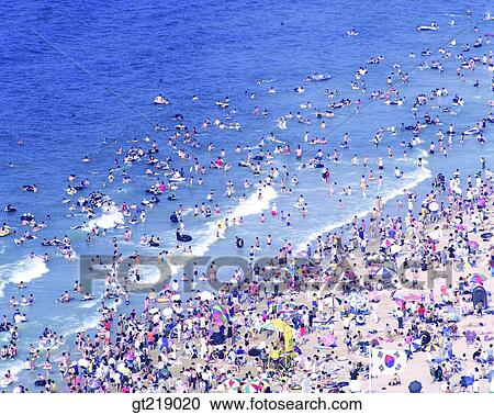 swimming beach, bathing resort, watering place, summer, sea, company, party View Large Photo Image Stock Image - swimming beach, bathing resort, watering place, summer, sea, company, party. Fotosearch