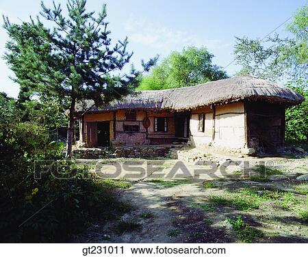 Stock Image - cottage, farm village, farming village, village, garden, yard, court. Fotosearch