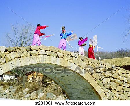 flying a kite, kite, child, children, kid Korean clothes, Korean dress, rockbridge View Large Photo Image Stock Image - flying a kite, kite, child, children, kid Korean clothes, Korean dress, rockbridge. Fotosearch
