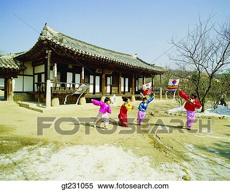 Stock Photography - flying a kite, kite, Korean clothes, Korean dress, child, children, kid. Fotosearch