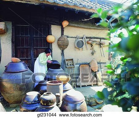 Picture - jar stand, jar, winnow, province, country, people, person. Fotosearch