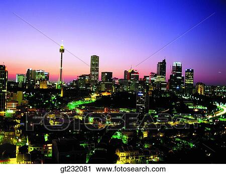 Stock Image - outdoor, exterior, night, night view, city, town scene, scene. Fotosearch