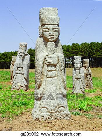 Stock Image - stone statue, stone Buddha, field, plain, outdoor, exterior, day. Fotosearch