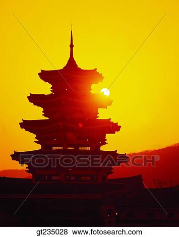 Stock Photo - sunrise, tower, pagoda, stone pagoda, stone tower, pagoda, sun. Fotosearch