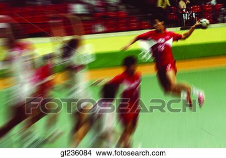 Picture - handball, people, person, handball game, match, stadium, handball game. Fotosearch