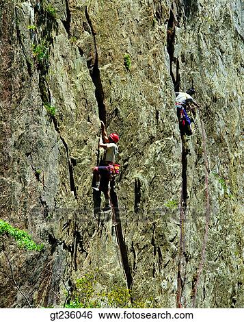 Stock Photograph - rock climbing, climbing, climb, people, person, leisure, hobby. Fotosearch