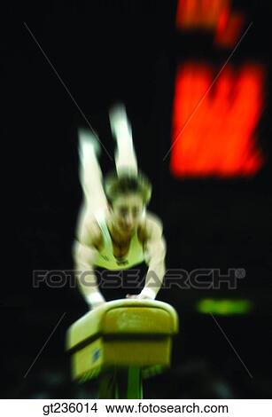 Picture - side horse, saddled horse, sieve, sifter, gymnastics, gymnastic, people. Fotosearch