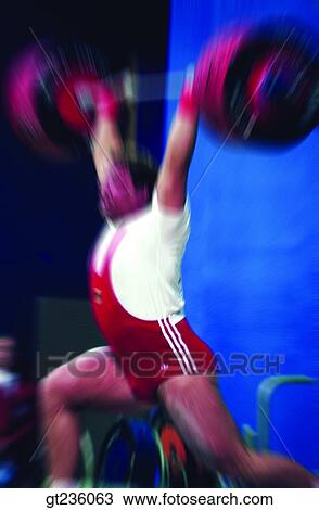 Stock Image - weight lifting, lifting, people, person, weight lifting player, barbell, weight. Fotosearch