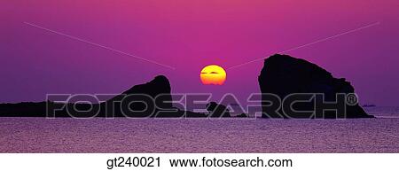 Stock Image - exterior, outdoor, sunset, night, red sky, sunrise, sunup. Fotosearch