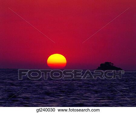 Stock Image - exterior, outdoor, sunset, night, red sky, sunrise, sunup. Fotosearch