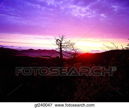 Stock Photo - outdoor, sundown, red sky, mountain. Fotosearch