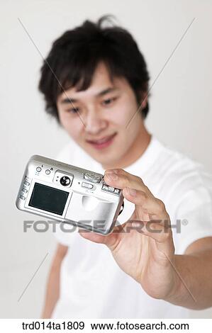 person, oriental, Korean, Asian, young man, camera View Large Photo Image Stock Photo - person, oriental, Korean, Asian, young man, camera. Fotosearch