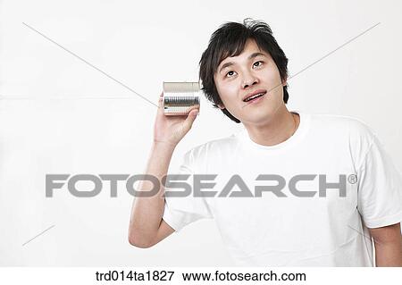 Stock Photo - person, oriental, Korean, Asian, young man, can. Fotosearch