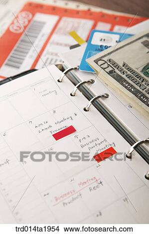 business, diary, money, paper money, foreign currency, dollar, close up View Large Photo Image Picture - business, diary, money, paper money, foreign currency, dollar, close up. Fotosearch
