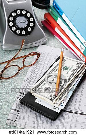 Stock Image - business, phonefile, money, paper money, currency, glasses, pencil. Fotosearch