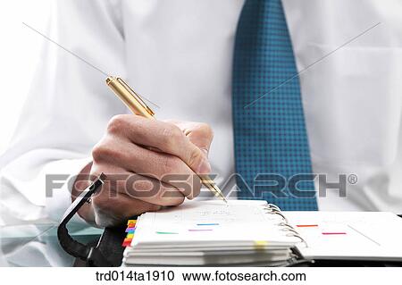 Stock Image - person, business, businessman, diary, writing, pen. Fotosearch