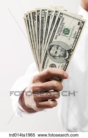 Stock Photography - person, business, economy, money, paper money, foreign currency, dollar. Fotosearch