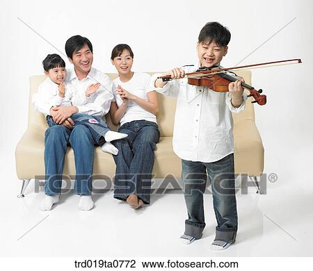 family, daytime, oriental, daughter, violin, person, sofa View Large Photo Image Stock Image - family, daytime, oriental, daughter, violin, person, sofa. Fotosearch