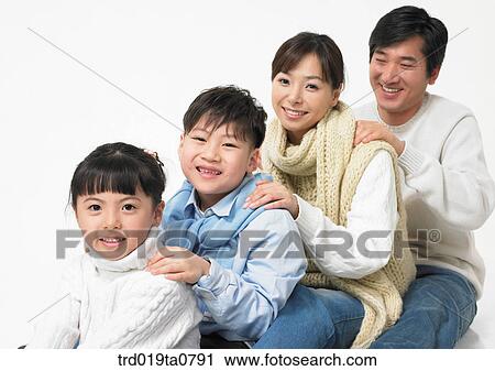 Stock Image - family, daytime, oriental, daughter, muffler, person, indoor. Fotosearch