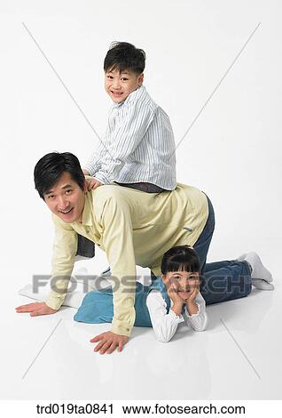 family, daytime, oriental, daughter, smile, person, indoor View Large Photo Image Stock Image - family, daytime, oriental, daughter, smile, person, indoor. Fotosearch