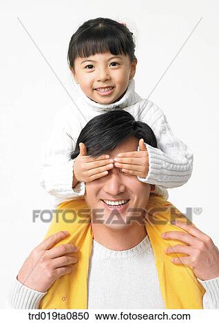 Stock Image - family, daytime, oriental, daughter, smile, person, indoor. Fotosearch