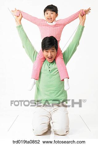 family, daytime, oriental, daughter, smile, person, indoor View Large Photo Image Stock Image - family, daytime, oriental, daughter, smile, person, indoor. Fotosearch