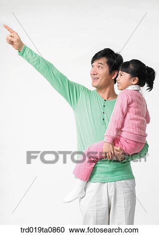 Stock Image - family, daytime, oriental, daughter, person, indoor, papa. Fotosearch
