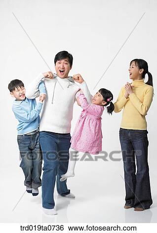 family, daytime, oriental, daughter, smile, person, indoor View Large Photo Image Stock Photograph - family, daytime, oriental, daughter, smile, person, indoor. Fotosearch
