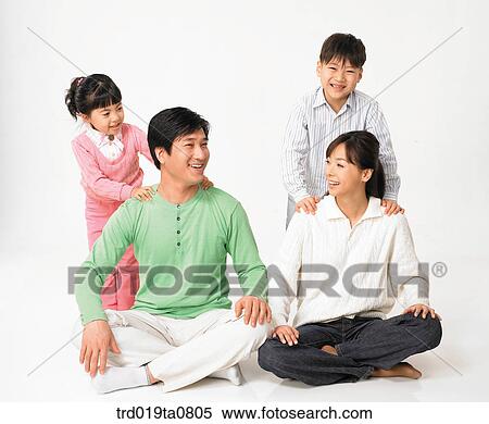 Stock Photography - family, daytime, oriental, daughter, person, indoor. Fotosearch