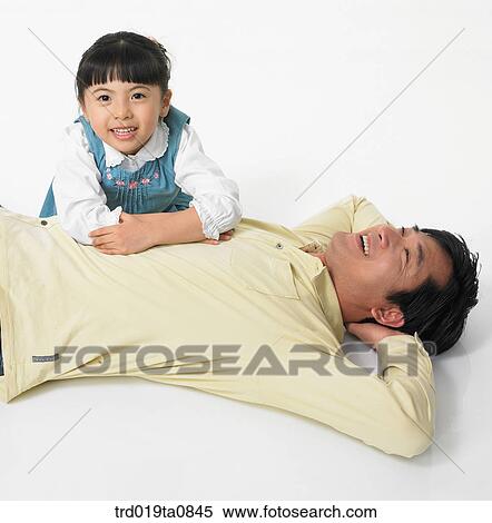 family, daytime, oriental, daughter, smile, person, indoor View Large Photo Image Stock Photography - family, daytime, oriental, daughter, smile, person, indoor. Fotosearch