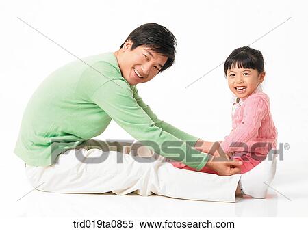 Stock Photography - family, daytime, oriental, daughter, smile, person, indoor. Fotosearch