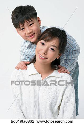 Stock Image - family, daytime, oriental, person, indoor, child. Fotosearch
