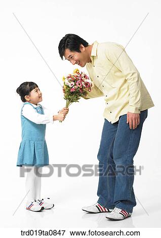 family, flower, flowerbunch, daytime, oriental, daughter, smile View Large Photo Image Stock Photo - family, flower, flowerbunch, daytime, oriental, daughter, smile. Fotosearch