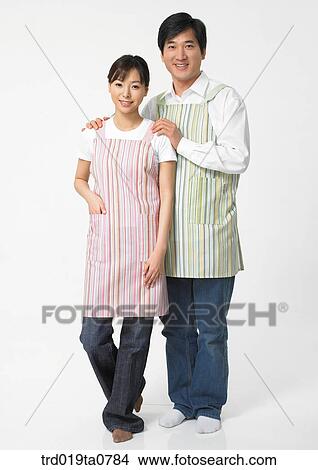 Picture - daytime, oriental, couple, person, indoor, apron, sweetheart. Fotosearch