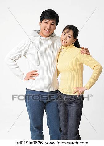 Stock Photograph - daytime, oriental, couple, person, indoor, woman. Fotosearch
